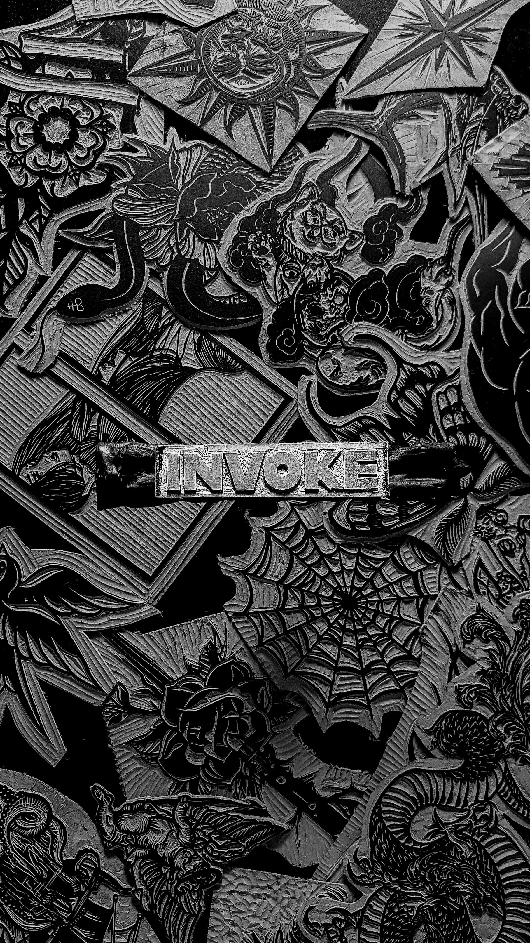 Decorative design with 'Invoke' text surrounded by intricate patterns on a black background